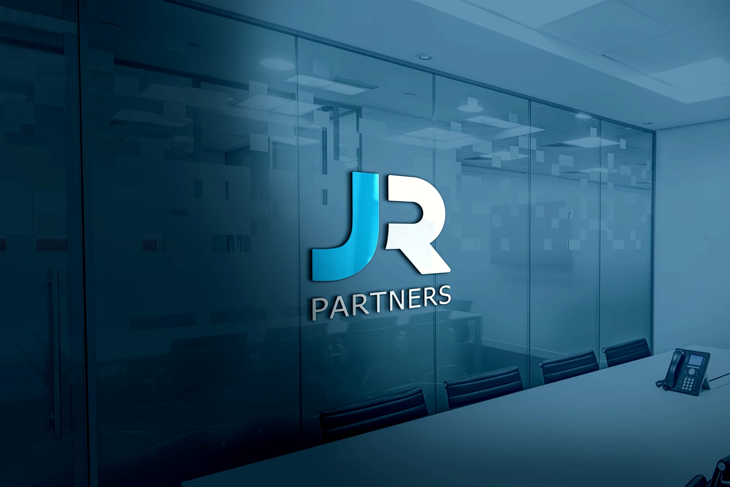 The logo on the frosted glass wall of a meeting room