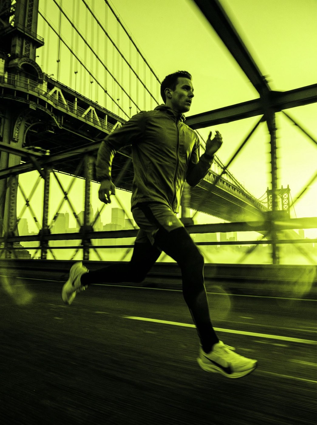 A man running across a bridge