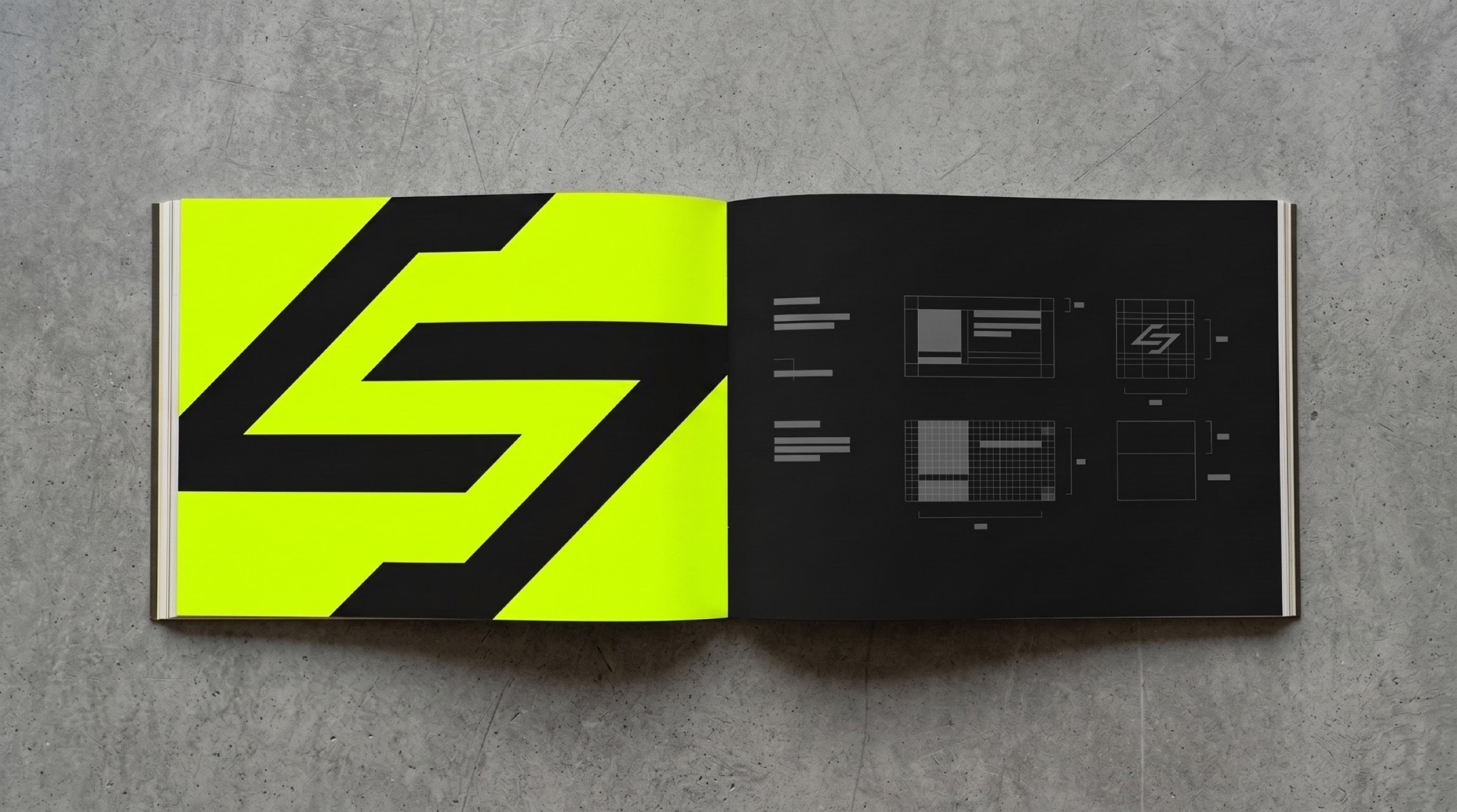 The open brand book: a giant black mark on lime beside layout pages