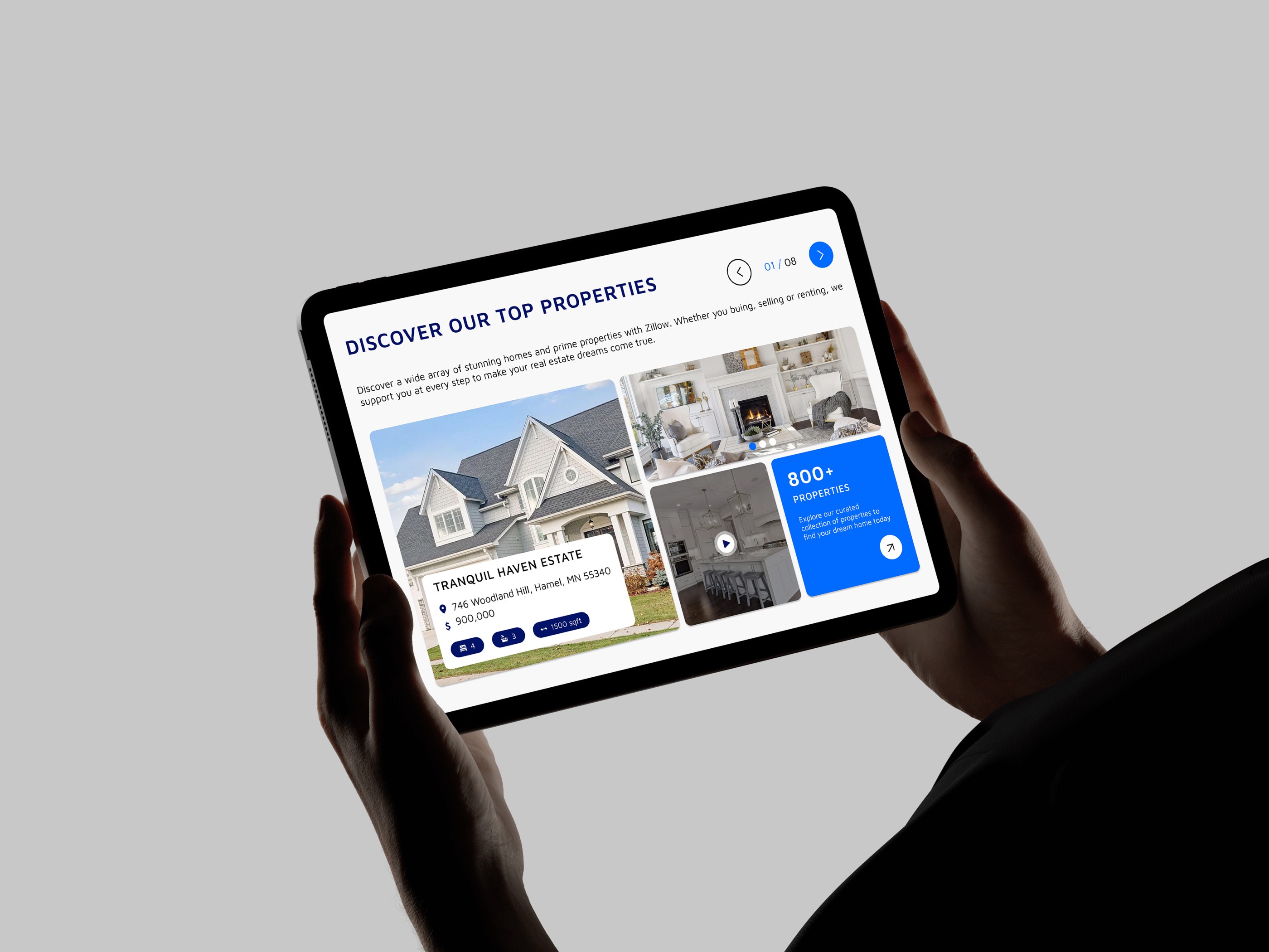 Hands holding a tablet with the redesigned properties section: Discover our top properties